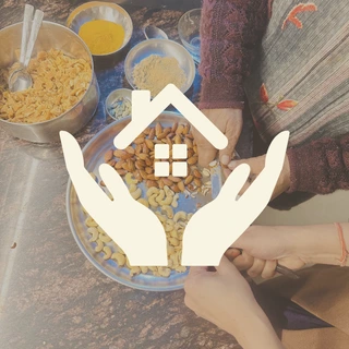 Women preparing handcrafted traditional Indian snacks and artisanal homemade food at Maatru Rasah using authentic Indian handmade cooking methods.
