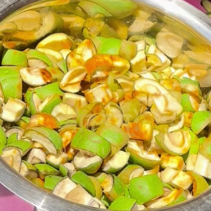 Salted mango pieces sun-curing for mango achaar